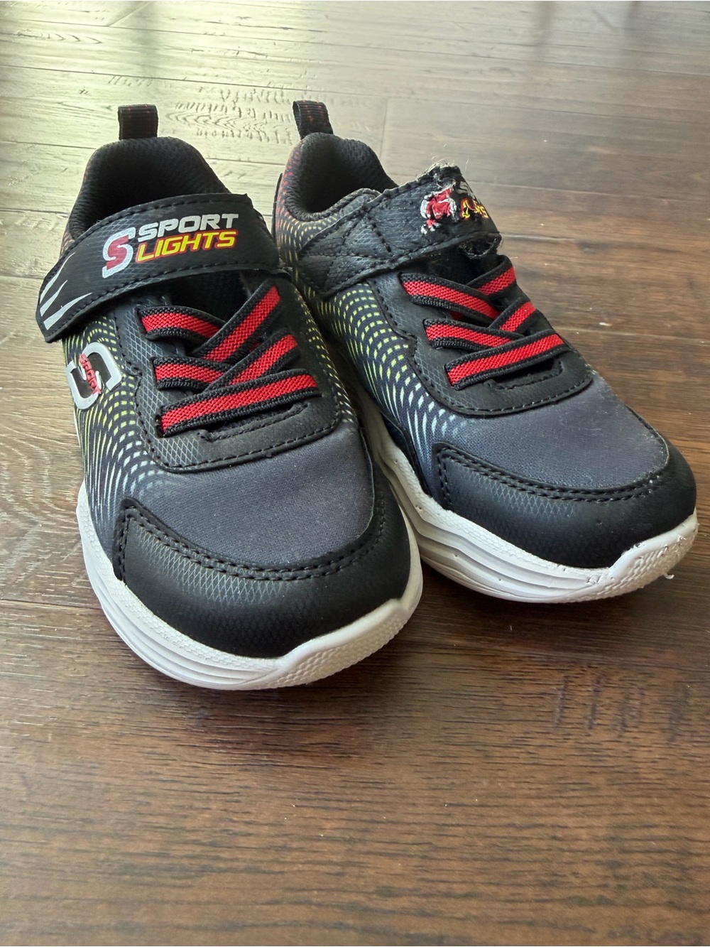 Skechers Kids Light Up Black Sneakers with Red Accents and Gray Soles - 9